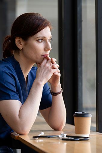 Veterinarian in a moment of quiet exhaustion at the clinic